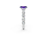 White gold Oval Cut Tanzanite Prong Setting with Side Stones on a Pave Band_2