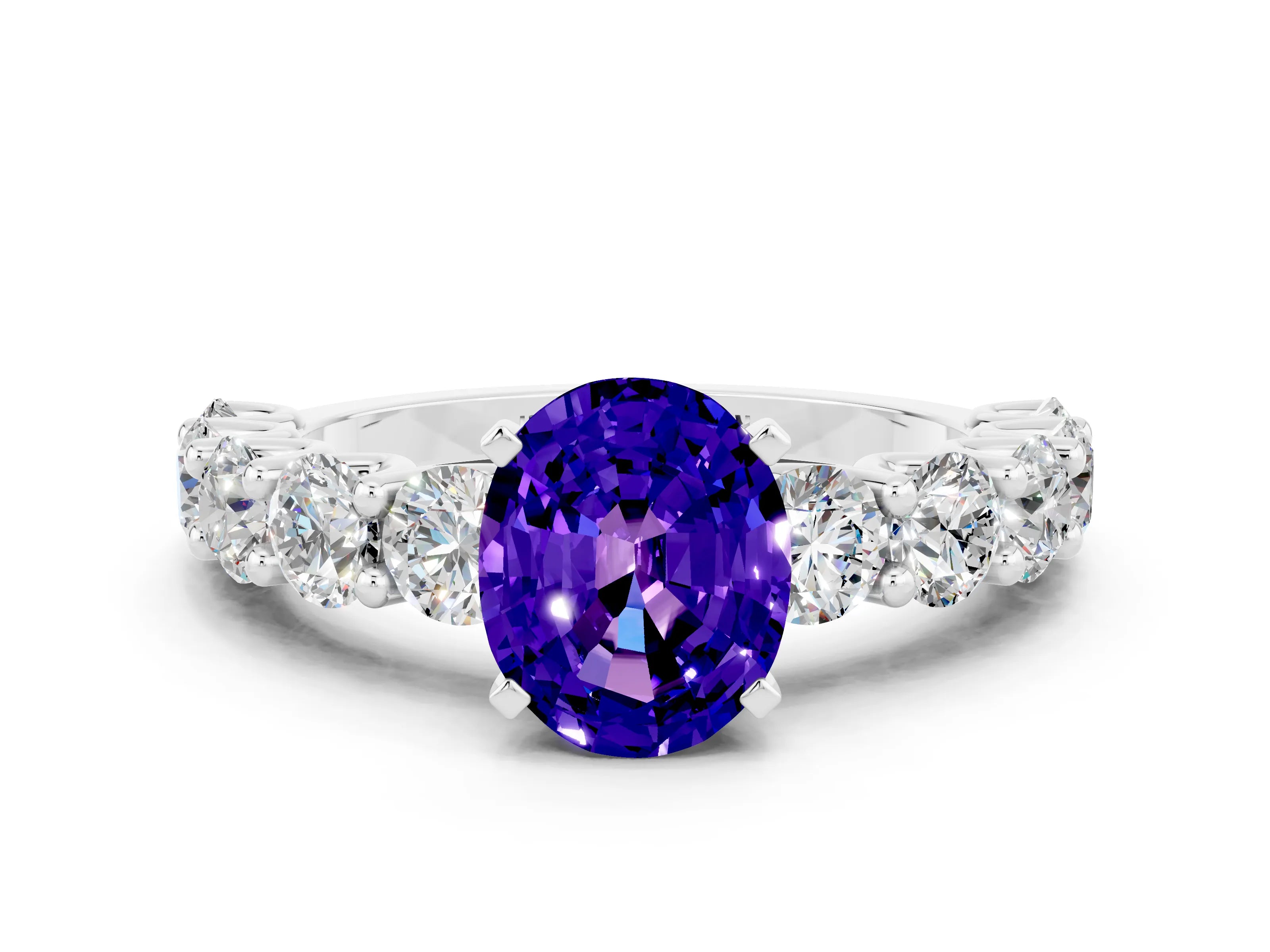 White gold Oval Cut Tanzanite Prong Setting with Side Stones on a Pave Band