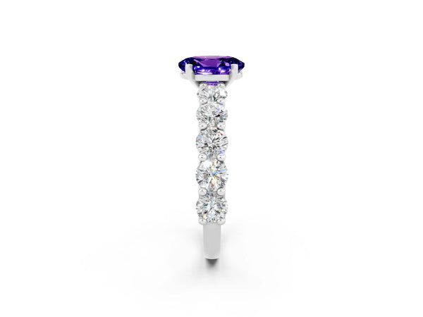 White gold Oval Cut Tanzanite Prong Setting with Side Stones on a Pave Band