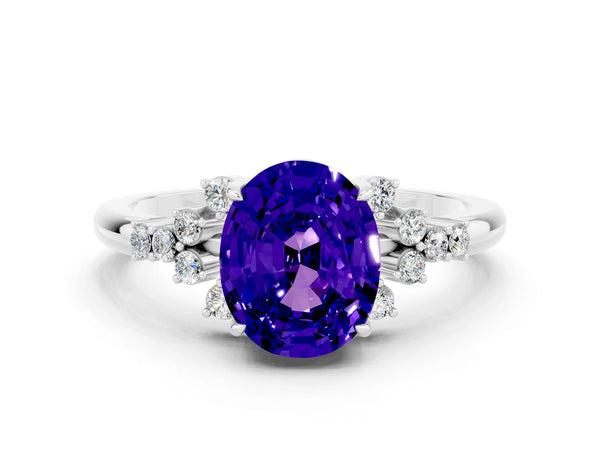 Platinum Oval Cut Tanzanite Ring with Side Stones and Four-Prong Setting