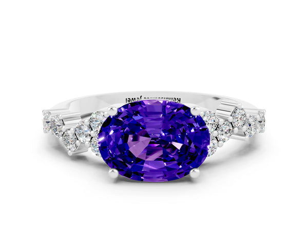 Platinum Oval Cut Tanzanite Scattered Round Accent Ring with Prong Setting