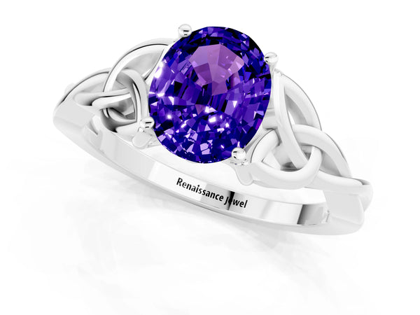 White gold Oval Cut Tanzanite Solitaire Engagement Ring with Celtic Knot Band and Four-Prong Setting