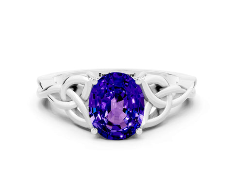 White gold Oval Cut Tanzanite Solitaire Engagement Ring with Celtic Knot Band and Four-Prong Setting
