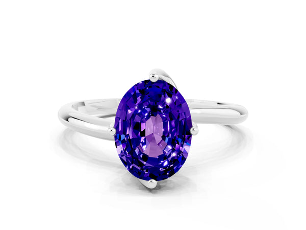 White gold Oval Cut Tanzanite Solitaire Engagement Ring with Four-Prong Setting and Classic Band