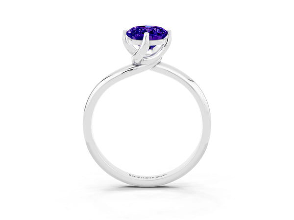 White gold Oval Cut Tanzanite Solitaire Engagement Ring with Four-Prong Setting and Classic Band