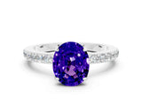 White gold Oval Cut Tanzanite Solitaire Engagement Ring with Pavé Band and Four-Prong Setting