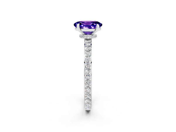 Platinum Oval Cut Tanzanite Solitaire Engagement Ring with Pavé Band and Four-Prong Setting