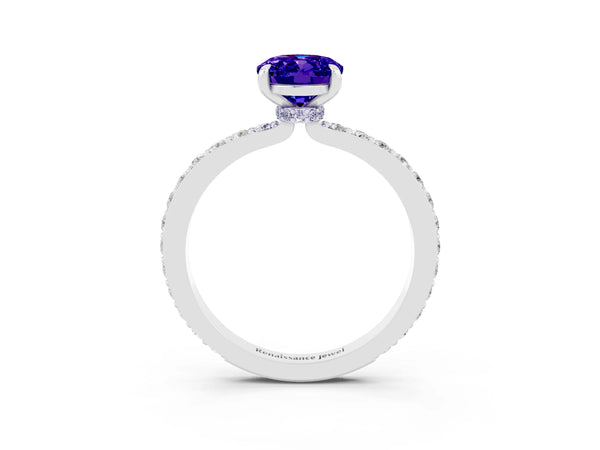 Silver Oval Cut Tanzanite Solitaire Engagement Ring with Pavé Band and Four-Prong Setting