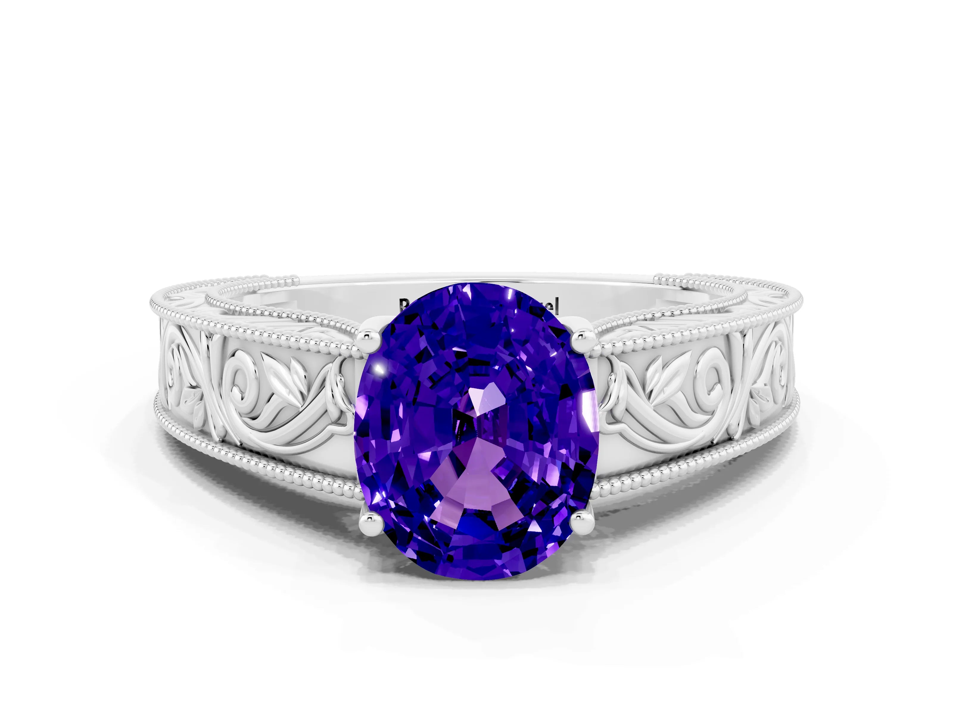 White gold Oval Cut Tanzanite Solitaire Ring with Engraved Band and Four-Prong Setting