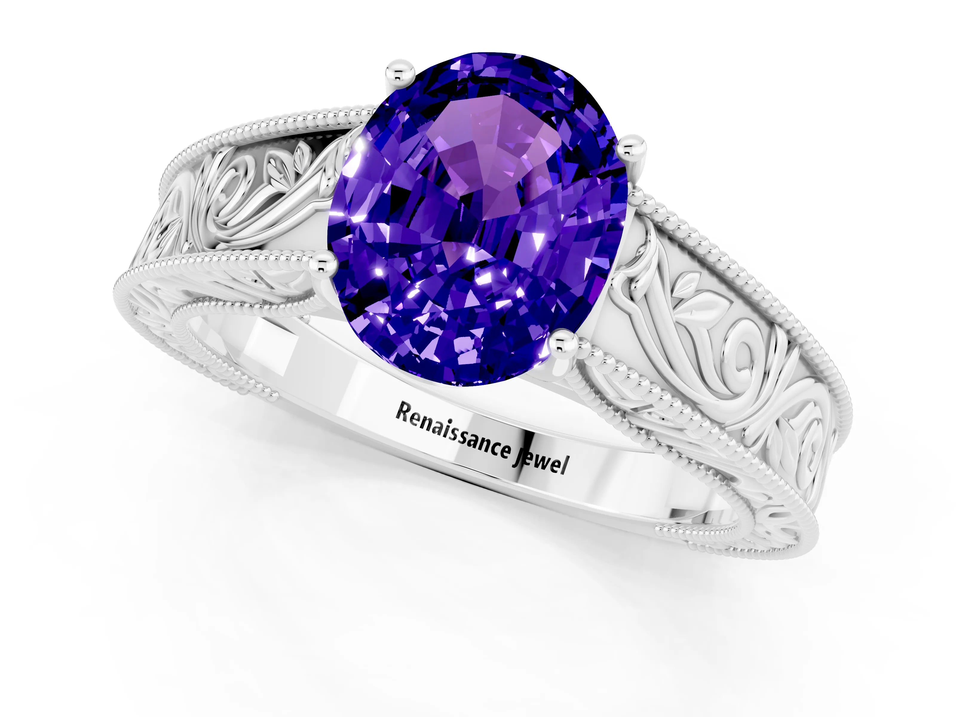 White gold Oval Cut Tanzanite Solitaire Ring with Engraved Band and Four-Prong Setting_1