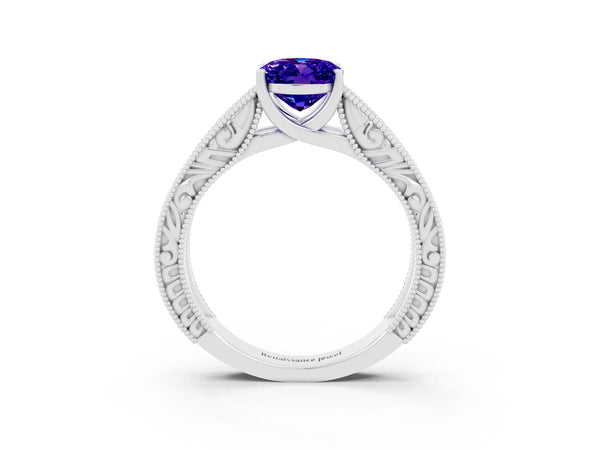 White gold Oval Cut Tanzanite Solitaire Ring with Engraved Band and Four-Prong Setting