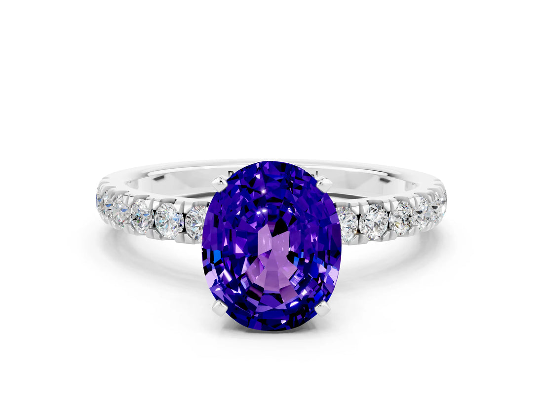 White gold Oval Cut Tanzanite Solitaire Ring with Pavé Accents and Four-Prong Setting