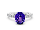 White gold Oval Cut Tanzanite Solitaire Ring with Pavé Accents and Four-Prong Setting
