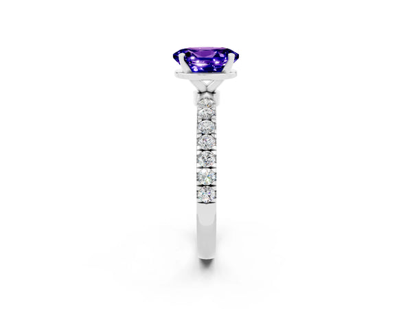 White gold Oval Cut Tanzanite Solitaire Ring with Pavé Accents and Four-Prong Setting