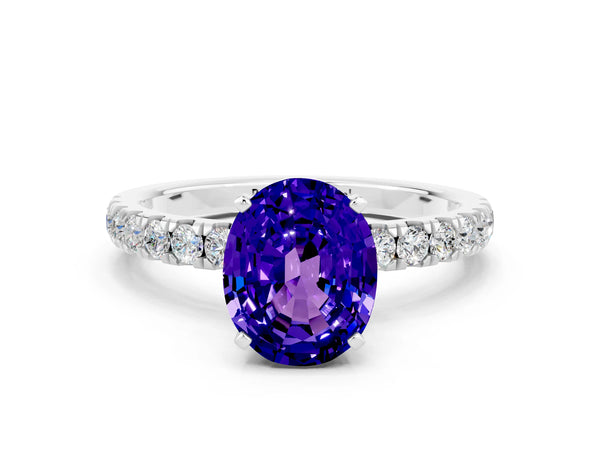Silver Oval Cut Tanzanite Solitaire Ring with Pavé Accents and Four-Prong Setting