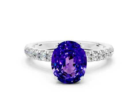 White gold Oval Cut Tanzanite Solitaire Ring with Pavé Accents and Four-Prong Setting