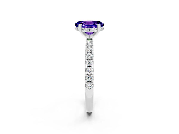 Silver Oval Cut Tanzanite Solitaire Ring with Round  Pavé Band and Four-Prong Setting