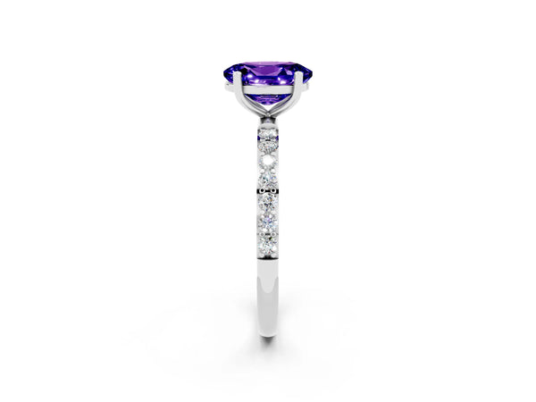 Platinum Oval Cut Tanzanite Solitaire Ring with Round  Pavé Band and Prong Setting