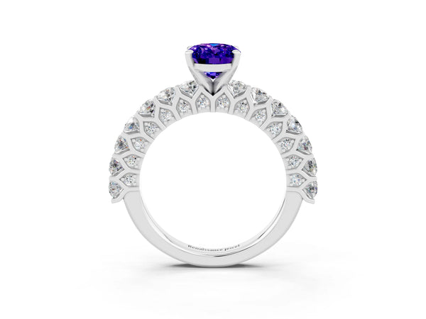 Platinum Oval Cut Tanzanite Solitaire Ring with Shared Prong Pavé Band and Four-Prong Setting