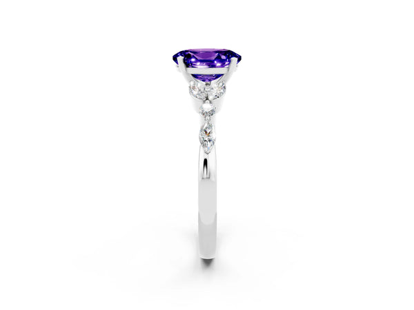 Platinum Oval Cut Tanzanite Solitaire Ring with Side Stones and Four-Prong Setting
