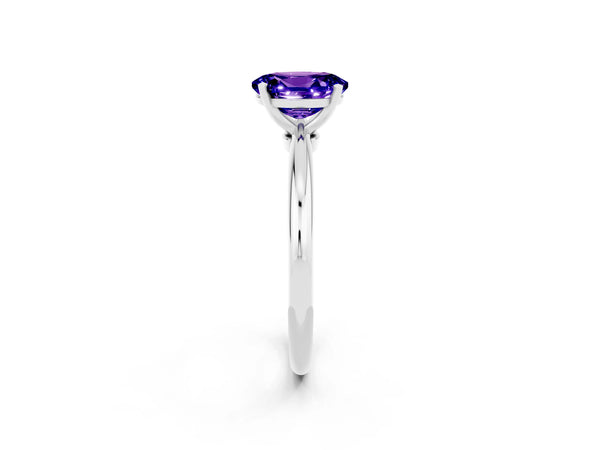 Silver Oval Cut Tanzanite Solitaire Ring with Six-Prong Setting and Classic Band