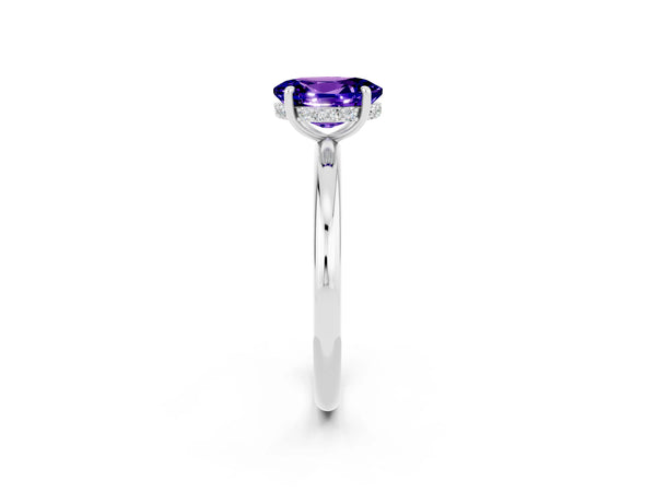 Platinum Oval Cut Tanzanite Solitaire Ring with Thin Band and Four-Prong Setting