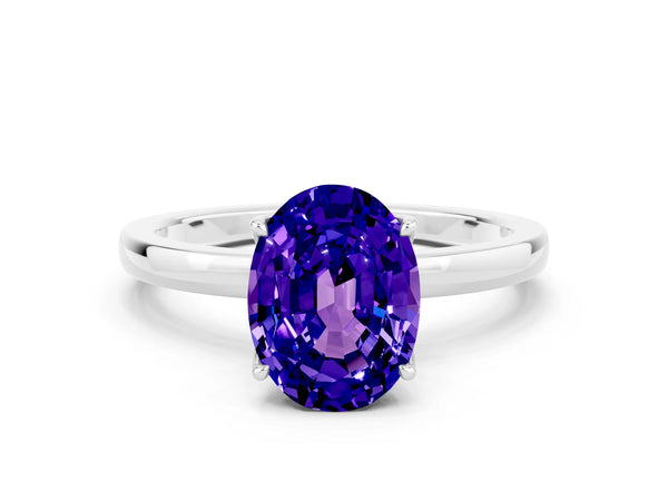 Platinum Oval Cut Tanzanite Solitaire Ring with Thin Band and Prong Setting