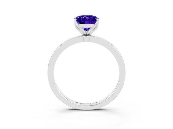 Platinum Oval Cut Tanzanite Solitaire Ring with Thin Band and Prong Setting