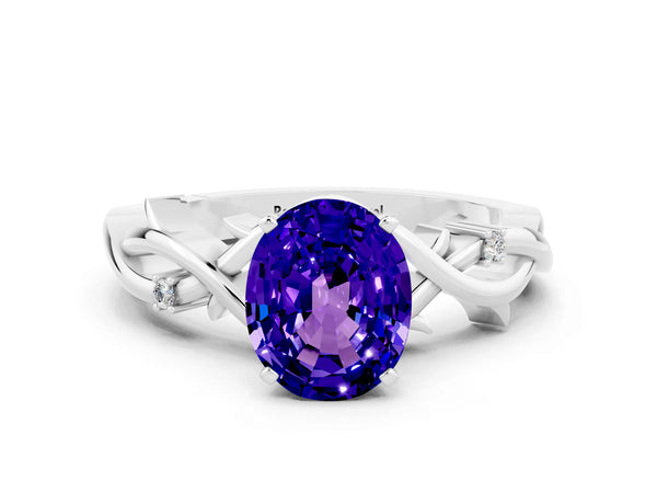 Silver Oval Cut Tanzanite Solitaire Ring with Twisted Band and Prong Setting