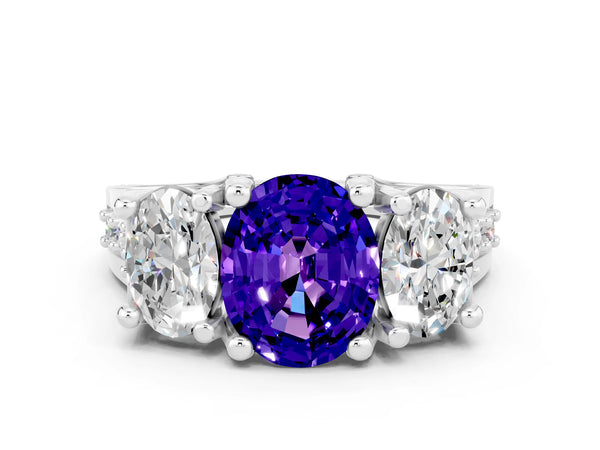 Platinum Oval Cut Tanzanite Three-Stone Ring with Channel Set Band and Four-Prong Setting