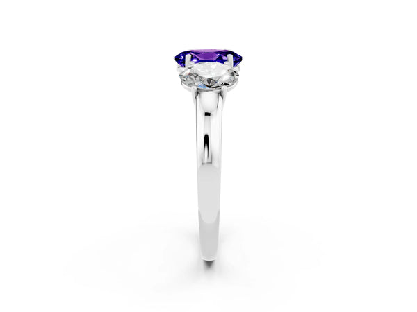 Platinum Oval Cut Tanzanite Three-Stone Ring with Four-Prong Setting and Classic Band