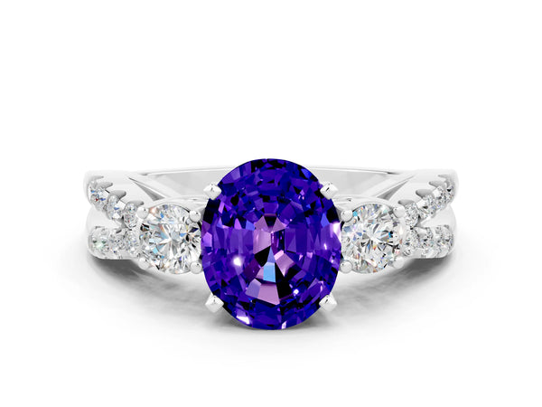 Platinum Oval Cut Tanzanite Three-Stone Ring with Pavé Split Shank and Four-Prong Setting