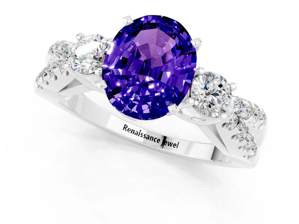 Platinum Oval Cut Tanzanite Three-Stone Ring with Pavé Split Shank and Four-Prong Setting