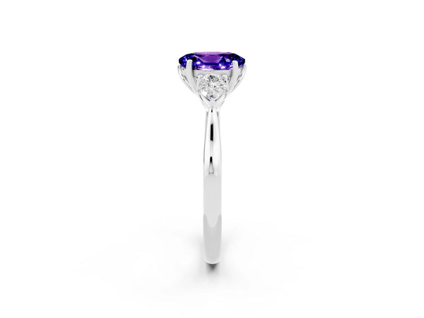Silver Oval Cut Tanzanite Three-Stone Ring with Pear  Side Stones and Prong Setting