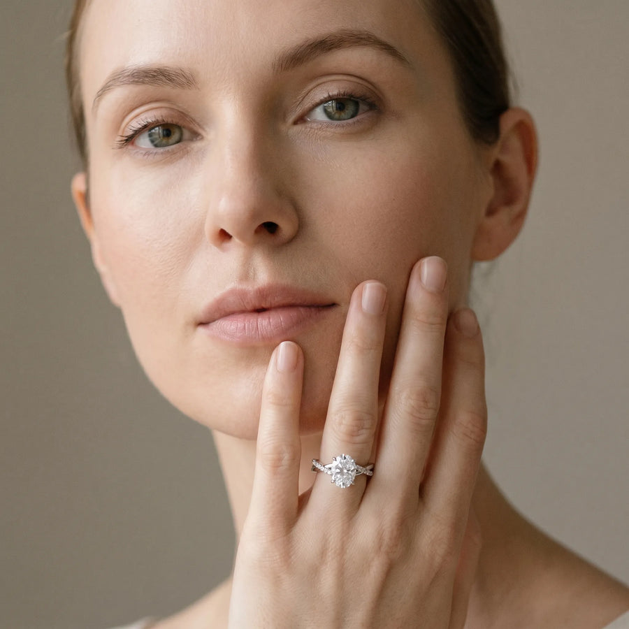 White gold Oval Cut Twist Band Solitaire Diamond Ring with Pavé Setting