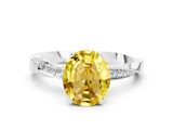 White gold Oval Cut Yellow Sapphire Engagement Ring with Side Stone Accents and Four-Prong Setting_36