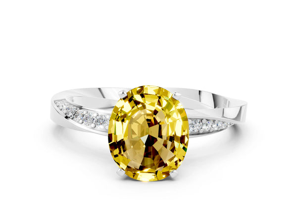 White gold Oval Cut Yellow Sapphire Engagement Ring with Side Stone Accents and Four-Prong Setting