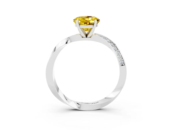 White gold Oval Cut Yellow Sapphire Engagement Ring with Side Stone Accents and Four-Prong Setting