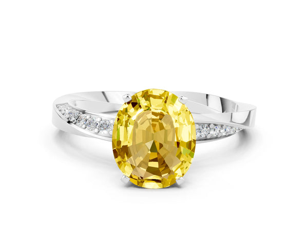Platinum Oval Cut Yellow Sapphire Engagement Ring with Side Stone Accents and Four-Prong Setting