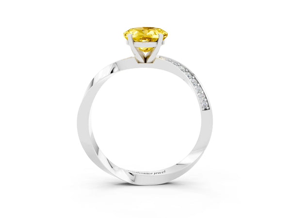 Platinum Oval Cut Yellow Sapphire Engagement Ring with Side Stone Accents and Four-Prong Setting