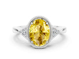White gold Oval Cut Yellow Sapphire Halo Ring with Tapered Band and Four-Prong Setting