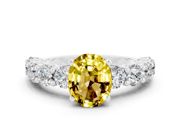 Silver Oval Cut Yellow Sapphire Prong Setting with Side Stones on a Pave Band