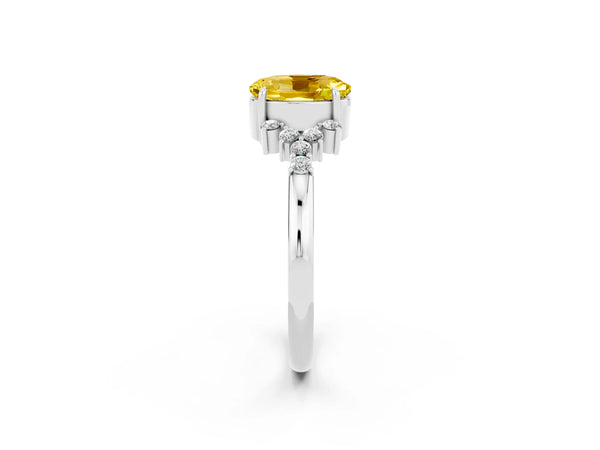 Silver Oval Cut Yellow Sapphire Ring with Side Stones and Four-Prong Setting