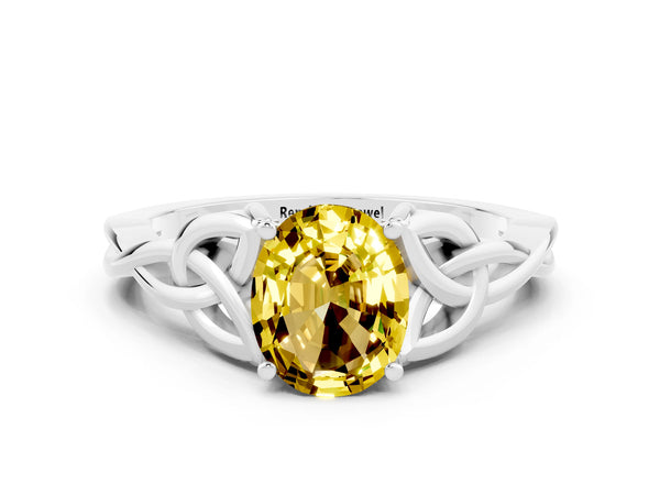 Platinum Oval Cut Yellow Sapphire Solitaire Celtic Knot Ring with Four-Prong Setting
