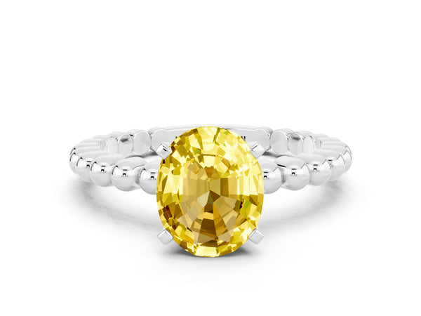 Platinum Oval Cut Yellow Sapphire Solitaire Ring with Beaded Band and Prong Setting