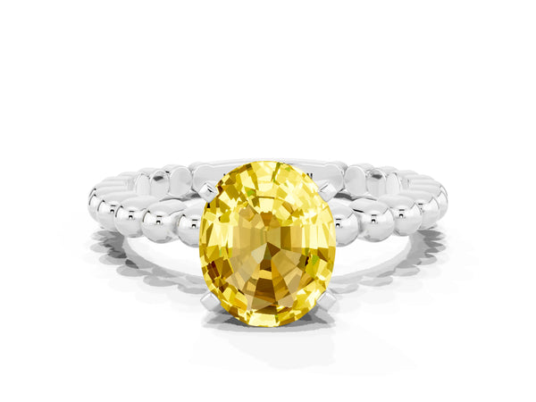 Silver Oval Cut Yellow Sapphire Solitaire Ring with Beaded Band and Prong Setting