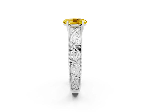 White gold Oval Cut Yellow Sapphire Solitaire Ring with Engraved Band and Four-Prong Setting