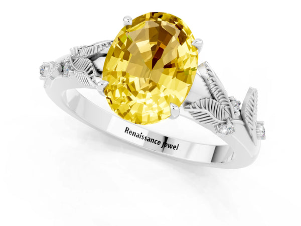 White gold Oval Cut Yellow Sapphire Solitaire Ring with Leaf Motif Band and Four-Prong Setting