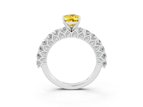 Platinum Oval Cut Yellow Sapphire Solitaire Ring with Shared Prong Pavé Band and Four-Prong Setting