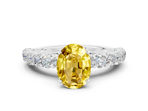White gold Oval Cut Yellow Sapphire Solitaire Ring with Shared Prong Pavé Band and Four-Prong Setting